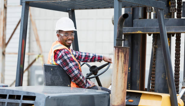 istock African-American man operating forklift 1199107259