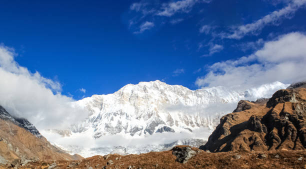 istock Snow-covered Mountain With Blue Sky, Cloud and Fog 1199114726