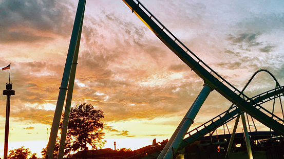 A captivating moment offers a glimpse of the Fury 325 roller coaster during dusk at Carowinds Amusement Park.