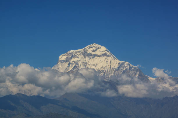 istock Snow-covered Mountain With Blue Sky, Cloud and Fog 1199116135