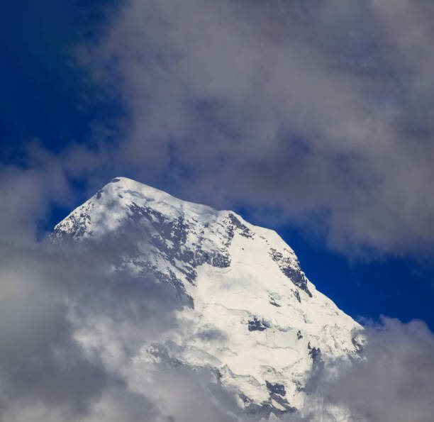 istock Snow-covered Mountain With Blue Sky, Cloud and Fog 1199116275