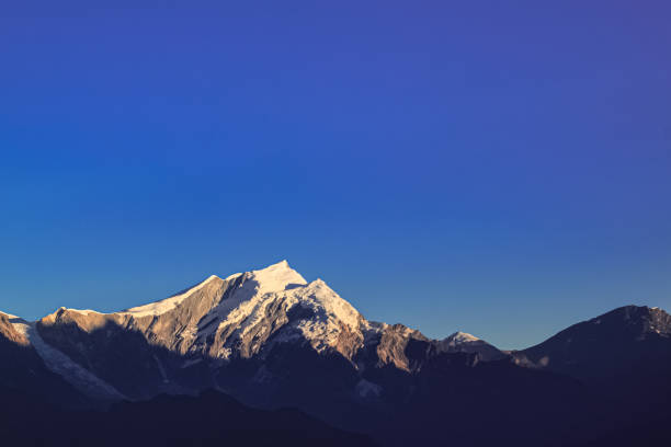 istock Snow-covered Mountain With Blue Sky, Cloud and Fog 1199117239