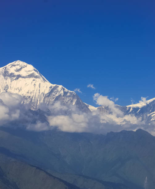 istock Snow-covered Mountain With Blue Sky, Cloud and Fog 1199120104