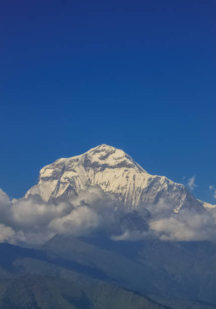 istock Snow-covered Mountain With Blue Sky, Cloud and Fog 1199120661