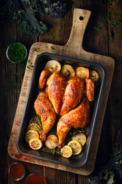 pollo arrosto farfallato - rotisserie roast chicken chicken roasted foto e immagini stock