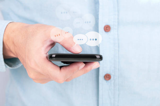 istock Businessman using her digital smartphone , Social network sharing and commenting in the online community concept 1199126710