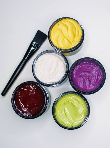 istock Multi-colored peeling creams with a brush. Closeup. 1199126861