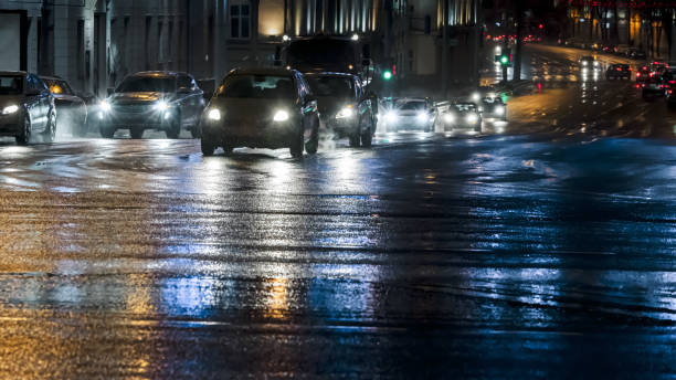 istock traffic on a rainy night. bad weather driving 1199131954