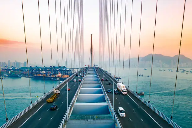 Photo of Drone view of Stonecutters Bridge and the Tsing sha highway at sunset