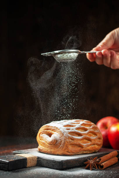 istock Strudel with apples and cinnamon is sprinkled with sugar powder 1199148324