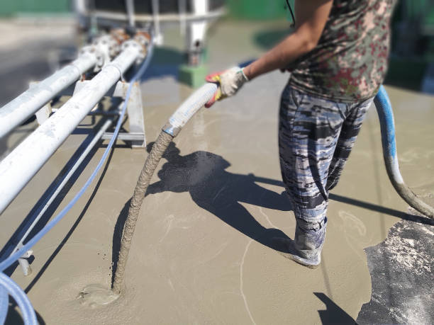 istock Roof floor cement mortar pouring 1199152539