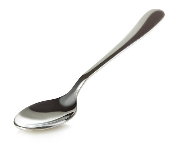 Wooden silver spoon isolated on white background.