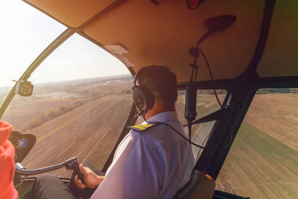 istock Helicopter pilot with passenger taking a turn with the vehicle 1199154967
