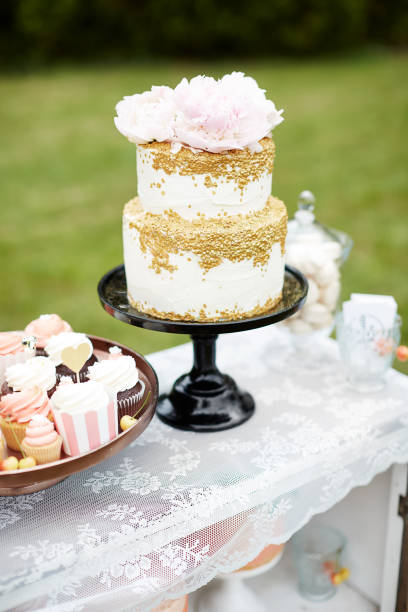 istock Cupcake and a Wedding Cake on a Sweet-Table 1199155024