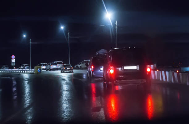 istock Traffic on a wet wet road 1199160974