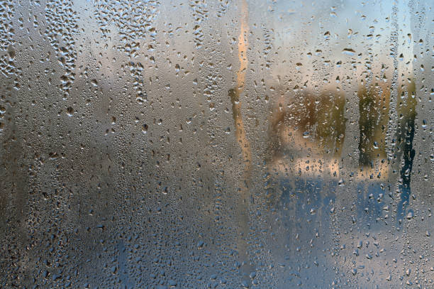 istock Drops on glass. Close-up background 1199161101