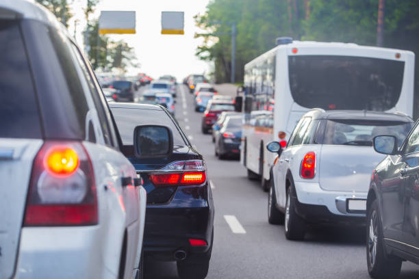 istock car in big traffic jam. Back view. 1199161250