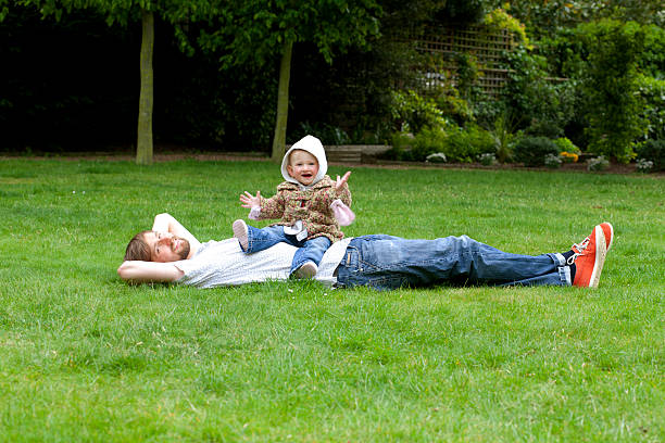 Happy father with child in the park stock photo