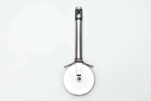 Photo of Pizza cutter on white background