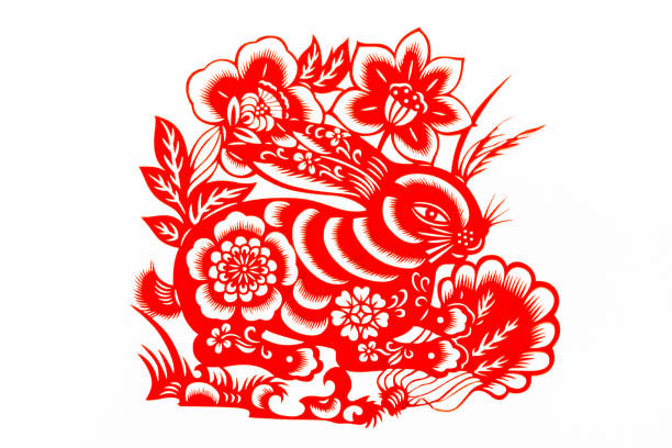 中国の伝統的な紙の切断、干支。中国の旧正月、ウサギの年。中国の動物月ウサギ伝統的なペーパーカットアートパターン。ウサギの紙切れ、旧正月。