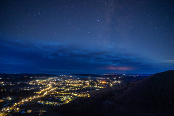 istock Starry sky over the night city 1199165015