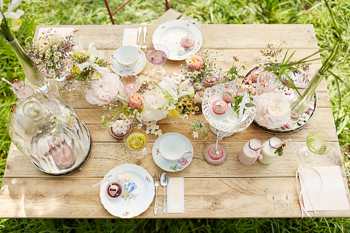 Different Pictures of a Wedding Table with Flowers, Cutlery and Place cards
