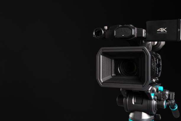 istock Professional 4K video camera close-up on black background 1199165735