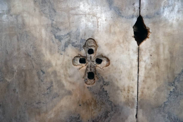 istock Christian cross on the marble wall. 1199166423