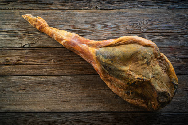 istock serrano ham whole leg on rustic wood 1199166598