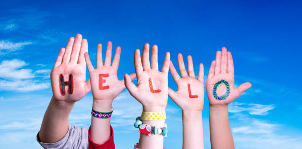 istock Children Hands Building Word Hello, Blue Sky 1199168189