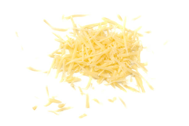 queso rallado aislado sobre fondo blanco. vista superior - grated fotografías e imágenes de stock