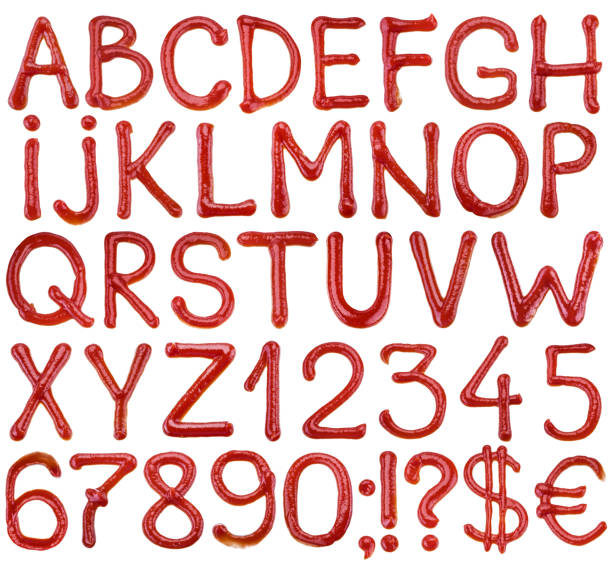 istock Alphabet - written ketchup sauce on a white background. 1199169475