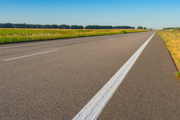 istock Morning landscape with empty high-way Dnipro-Kharkiv in central Ukraine 1199169546