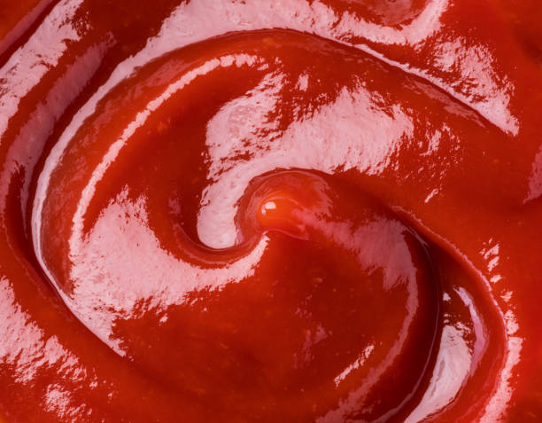 istock Ketchup or tomato sauce puddle. Close-up. 1199169676