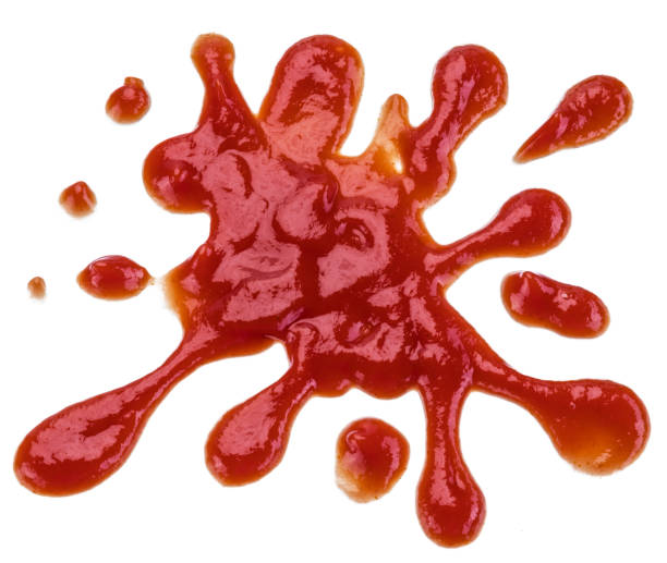 istock Ketchup or tomato sauce puddle isolated on white background. 1199169694