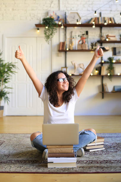 istock Young woman sitting and working 1199169698