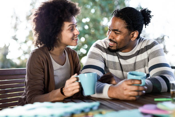istock Happy black couple talking during coffee time on a terrace. 1199170806