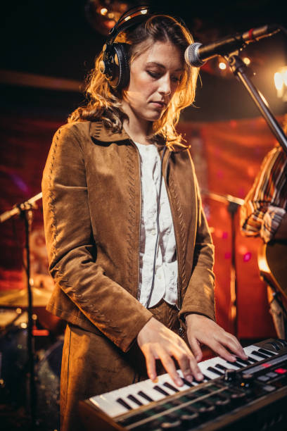 istock Lady musician playing keyboard 1199171495