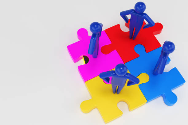 istock Four 3d man are standing on pieces of the puzzle. 3d rendering 1199172353