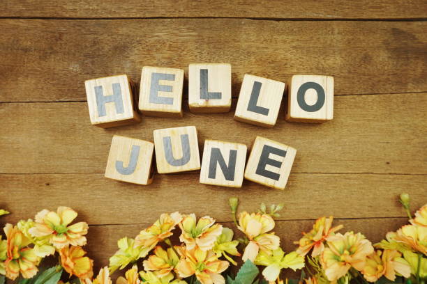 istock Hello June alphabet letters on wooden background 1199174173