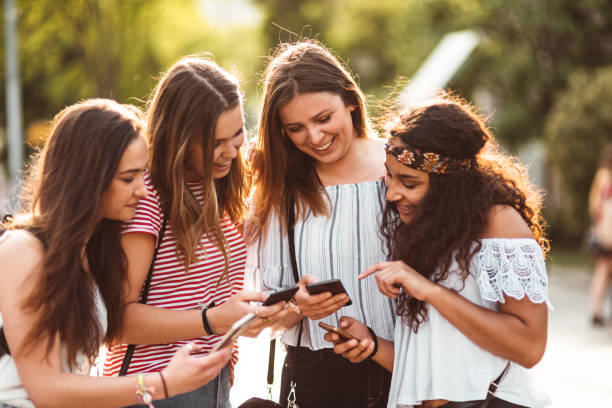 istock teens using the smartphone in the city 1199175861