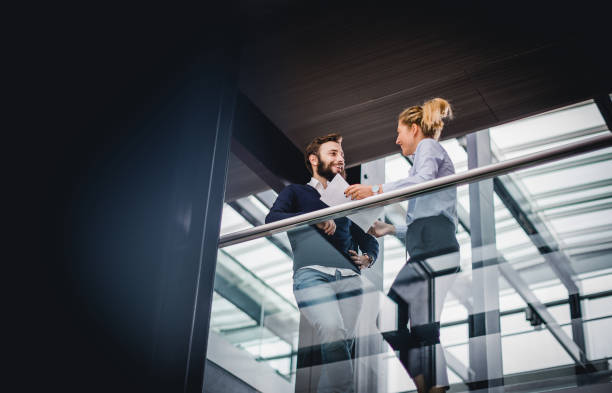 istock Two business people discussing on the hallway 1199175898