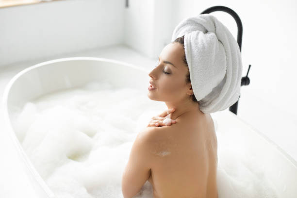 istock Women relaxing in a bathtube 1199176012