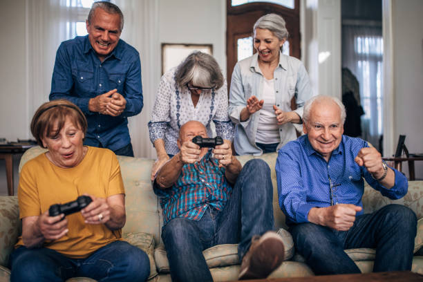 istock Senior friends playing video games 1199178549