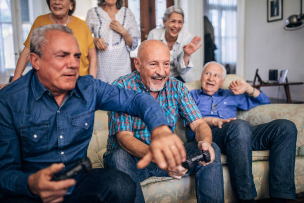 istock Old people playing video games 1199178637