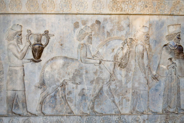 istock People Bringing Gifts For Ruler on Persepolis Engraving 1199179745