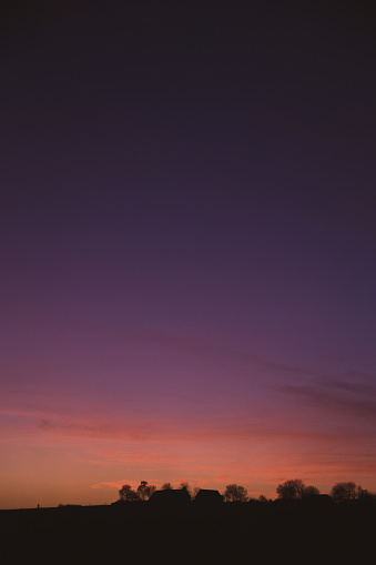 Sunset sky with blue and golden orange colors at dusk background