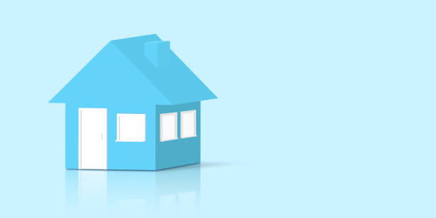 istock Small model house in monochrome blue shades and background with a mirror shadow. 1199184135