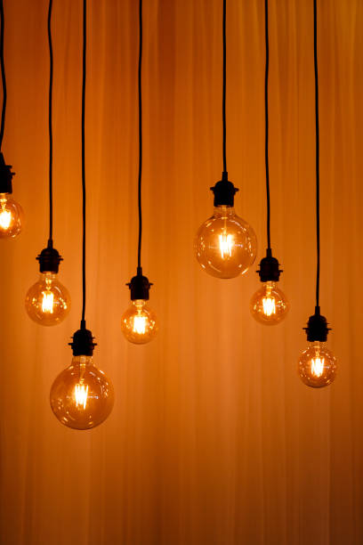 istock Vintage lights bulb retro style. background for screensaver. 1199189896