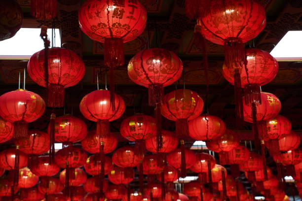 istock Many illuminated red Chinese lanterns with some Chinese characters on it 1199190341